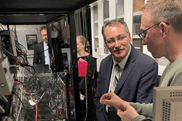 Technology Minister Dr Shane Reti (centre)