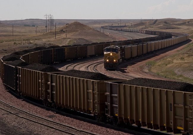 Vast coal trains snake through the Powder River Basin in Wyoming, where the biggest US coal mines are located.