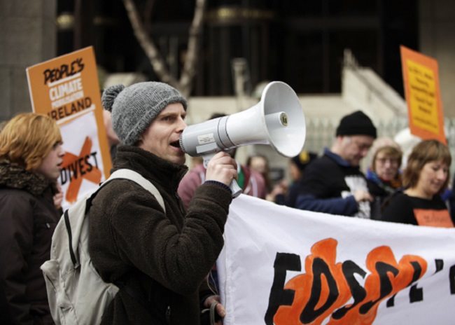 Campaigners try to make their voices heard at a fossil fuels disinvestment march in Ireland.