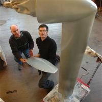 Bill Currie (left) and Wayne O'Hara assemble a Powerhouse Wind turbine.