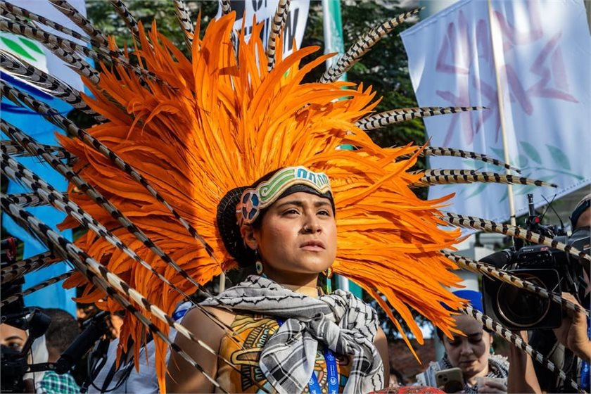 An Indigenous activist during demonstrations at the COP28 opening in Dubai, 2023.