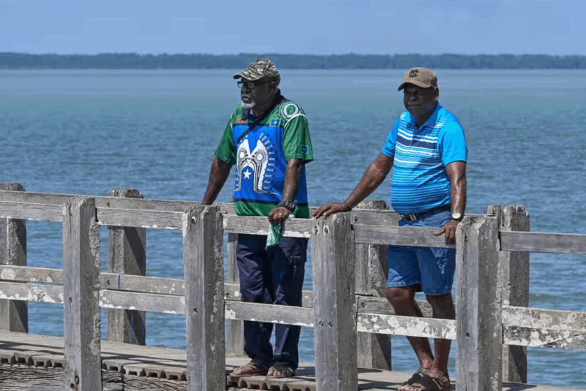 Paul Kabai and Pabai Pabai on the boardwalk in Boigu.