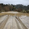 Riwaka Sandy Bay Road during recent flooding Riwaka Sandy Bay Road during recent flooding