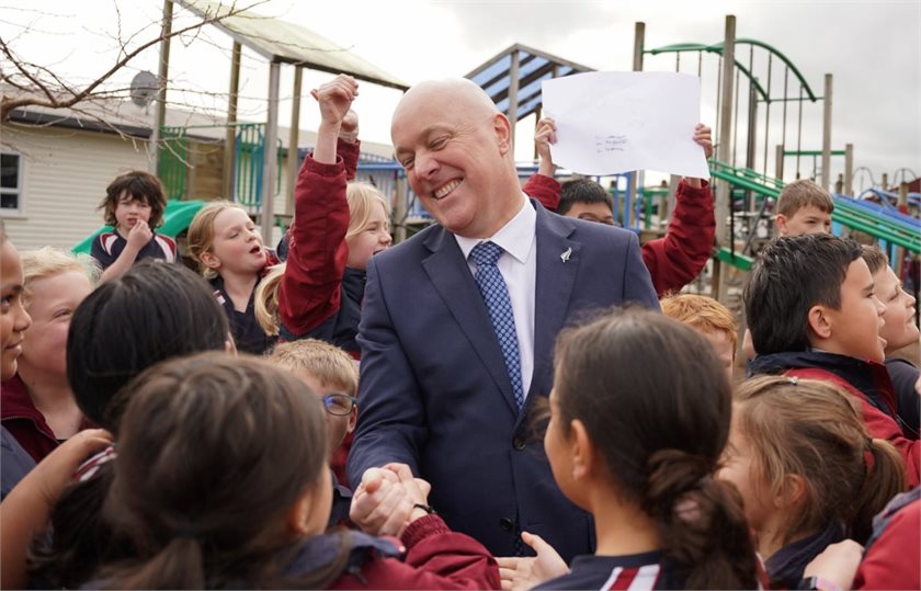 Prime Minister Christopher Luxon greets schoolchildren