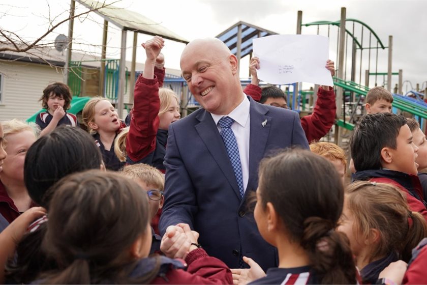 Prime Minister Christopher Luxon greets schoolchildren
