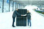 Snowplanet General Manager, Rojie Aguilar, right, and Sunergise Installation Business Manager, James Hogg, with one of the 2,317 installed solar panels that help keep the slopes frozen