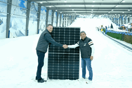 Snowplanet General Manager, Rojie Aguilar, right, and Sunergise Installation Business Manager, James Hogg, with one of the 2,317 installed solar panels that help keep the slopes frozen