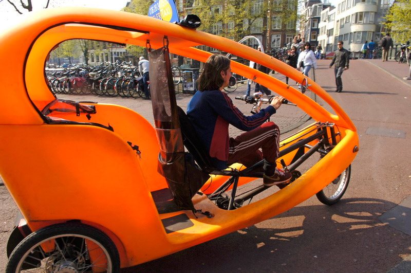 Bicycle-taxi in the streets of Amsterdam.