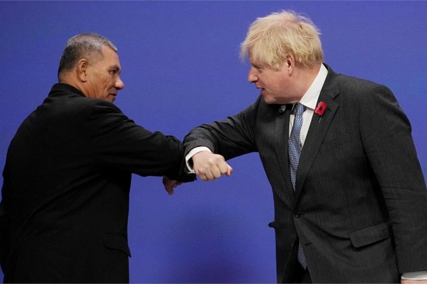 Tuvalu PM Kausea Natano and UK PM Boris Johnson bumping arms