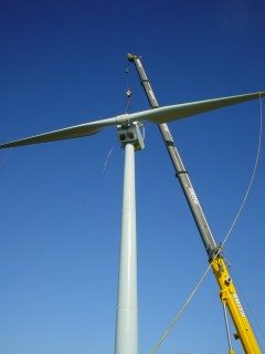 A Kiwi made Windflow turbine being installed ... company's shares trading steady around $3 mark